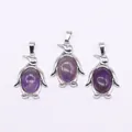 Drie zilveren pinguïnhangers met ovale paarse stenen en metalen haakjes - Amethist