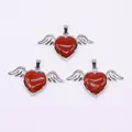 Three red heart stones with silver angel wings pendants on a white background - 30x53mm / Red Jasper