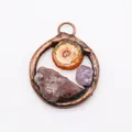 Detail of vintage round bronze pendant with natural raw stones and copper wire wrapping - Style 1 (Reddish Brown, Orange Yellow, Purple Stones)