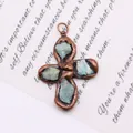 Macro shot of bronze cross pendant with natural turquoise stones on vintage background - Style 3 (Amazonite)