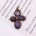 Detailed macro view of vintage bronze flower pendant with purple raw crystal stones - Style 2 (Amethyst)