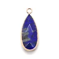 Macro shot of faceted water-drop Lapis Lazuli pendant with elegant gold plated metal edging - Lapis Lazuli