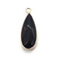 Detail of faceted black teardrop pendant with gold-plated bezel for jewelry making - Black Agate