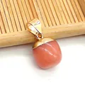 Close-up of a teardrop-shaped pink natural stone pendant with a golden metal clasp - Orange Jade