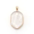 Macro detail of hexagonal strawberry quartz pendant with rose gold plated metal frame - White Crystal