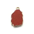 Close-up of irregular red-brown goldstone pendant with golden plating and bail connector - Gold Sandstone