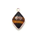 Macro detail of diamond-shaped tiger eye stone pendant with rose gold plated edge - Tiger's Eye