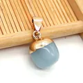 Translucent light blue teardrop stone pendant with a polished gold metallic cap - Synthetic Blue Jade