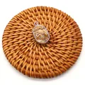 Natural landscape stone oval pendant with silver plated edge on a woven coaster - Jasper
