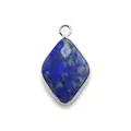 Macro view of faceted diamond-shaped blue lapis lazuli pendant with silver metal plating - Lapis Lazuli