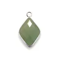 Detail of a faceted green natural stone pendant with silver plated metal edges and ring - Green Aventurine