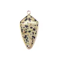Close-up of leaf-shaped Dalmatian Jasper pendant with polished gold metal edging and bail - Dalmatian Jasper