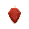 Detailed view of red shield-shaped stone pendant with gold-plated edges for DIY jewelry - Red Jasper