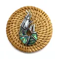 Macro detail of shrimp-shaped brooch with iridescent abalone shell inlay on silver metal - 28x53mm / Abalone Shell