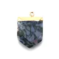 Macro shot of sword-shaped natural stone pendant with polished golden metal frame - Blue Spot Stone
