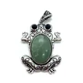 Macro shot of frog pendant with green stone and retro silver floral engraving detail - Green Aventurine