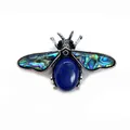 Detail of bee brooch featuring iridescent abalone shell wings and blue gemstone inlay - 41x57mm / Lapis Lazuli