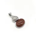 Macro detail of red goldstone pendant featuring vintage filigree metalwork and zircon - 2.8cmx4.7cm / Gold Sandstone