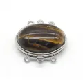 Macro detail of oval tiger eye stone in triple strand zinc alloy jewelry clasp connector - Tiger's Eye
