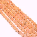 Vista macro de cuentas de piedra natural en forma de estrella melocotón para joyas - Textura Naranja Rosa Melocotón (No. 16)