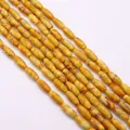 Gros plan de perles en pierre impériale en forme de riz aux textures jaune et rouge - 5x12mm (16g) / Jaune Vif (N°13)