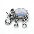 Silver-tone elephant brooch featuring retro texture and oval white opal inlay - 36x43mm / Opal