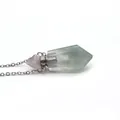 Macro shot of translucent green natural stone perfume bottle pendant with silver chain - Purple Fluorite