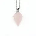 Pink crystal hexagonal cone perfume bottle necklace with silver chain on white background - Rose Quartz