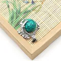 Retro dragon claw pendant with turquoise colored round bead and silver finish - Turquoise