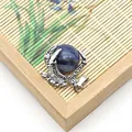 Silver dragon claw pendant holding a round natural blue sodalite stone sphere - Blue Sodalite