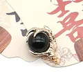 Golden dragon claw pendant holding a smooth black round stone bead charm - Black Agate