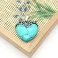 Boheemse hartvormige turquoise stenen hanger met een gegraveerde vintage zilveren oogje - Blauw Turkoois