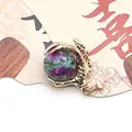 Golden dragon claw pendant featuring a round ruby zoisite natural stone bead - Ruby Zoisite