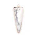 Macro detail of elongated triangle white marble stone pendant with rose gold plated frame - Howlite
