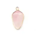 Detailed close-up of shield-shaped pink quartz stone pendant with gold plating finish - Rose Quartz
