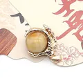 Golden dragon claw pendant featuring a semi-transparent yellow gemstone ball charm - Old Yellow Jade