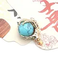 Golden dragon claw pendant with turquoise bead on a traditional decorative card - Blue Turquoise