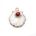 Detail of scallop shell pendant with white mother of pearl and red stone inlay - Red Jasper