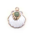 Detail of scallop shell pendant with green stone inlay and gold-plated finish - Green Aventurine