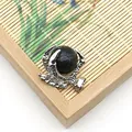Ciondolo artiglio di drago in argento antico con sfera in marmo nero su bambù - Howlite a Linee Nere
