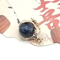 Golden dragon claw pendant featuring a round blue natural stone bead for DIY jewelry - Blue Sodalite