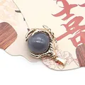 Golden dragon claw pendant featuring a polished dark gray round stone for DIY jewelry - Grey Agate