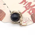 Golden dragon claw pendant featuring a deep blue star sandstone orb for DIY jewelry - Blue Sandstone