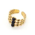 Detailed macro view of triple-layered 18K gold ring with black gemstone accents - One Size / Black Agate