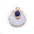 Natural shell scallop pendant with lapis lazuli stone and golden metal edging - Lapis Lazuli
