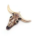 Detailed view of resin bull skull pendant with metallic rose gold electroplated horns - 43x58mm / Brown (No. 1)