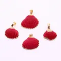 Close-up of four red shell pendants with gold plated edges for DIY jewelry making - Dark Red