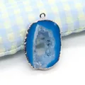Macro shot of oval blue natural agate druzy pendant with silver plated edge and bail - Sky Blue