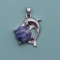 Detailed view of dolphin-shaped pendant with purple marble stone and silver metal - Blue Spot Stone