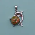 Silver dolphin pendant featuring a round green and pink unakite natural stone bead - Unakite